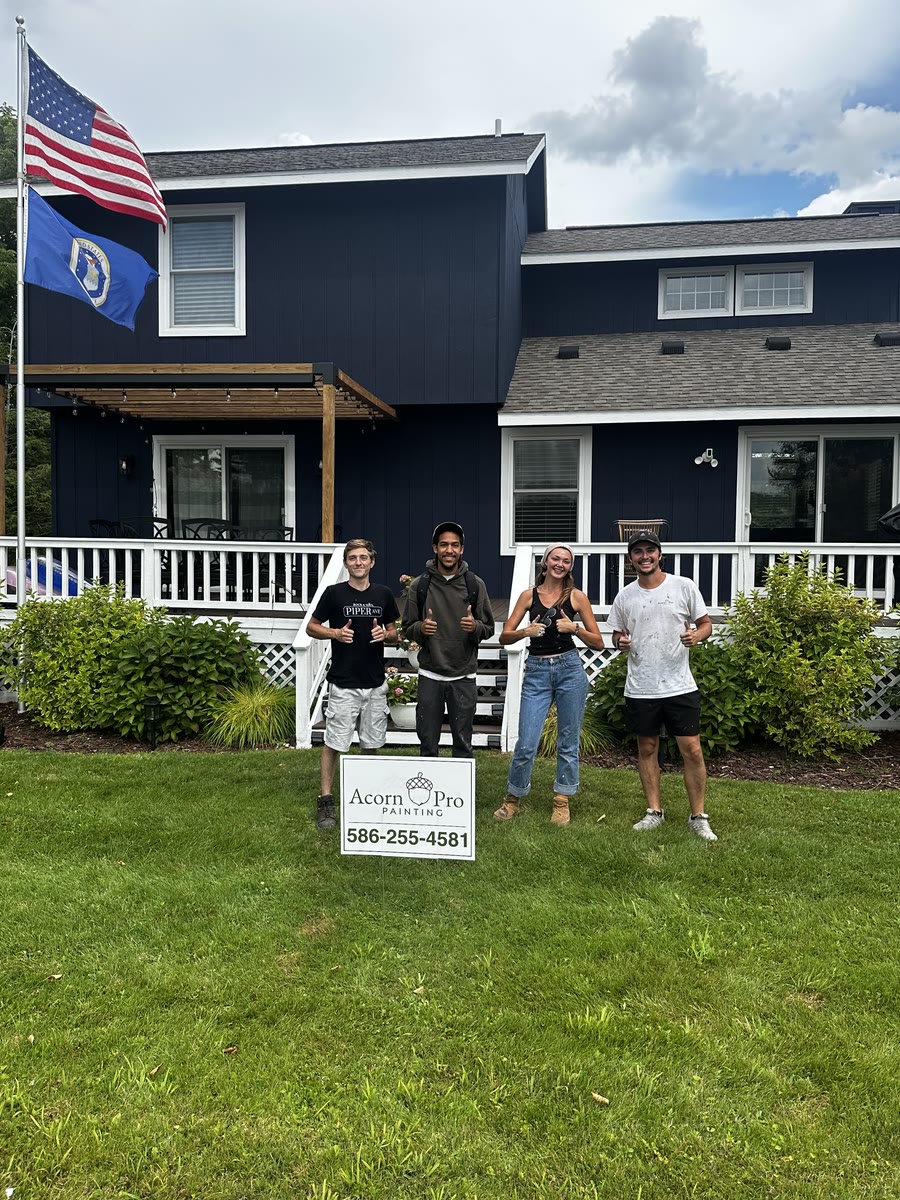 The Acorn Pro Painting crew in front of a freshly painted home