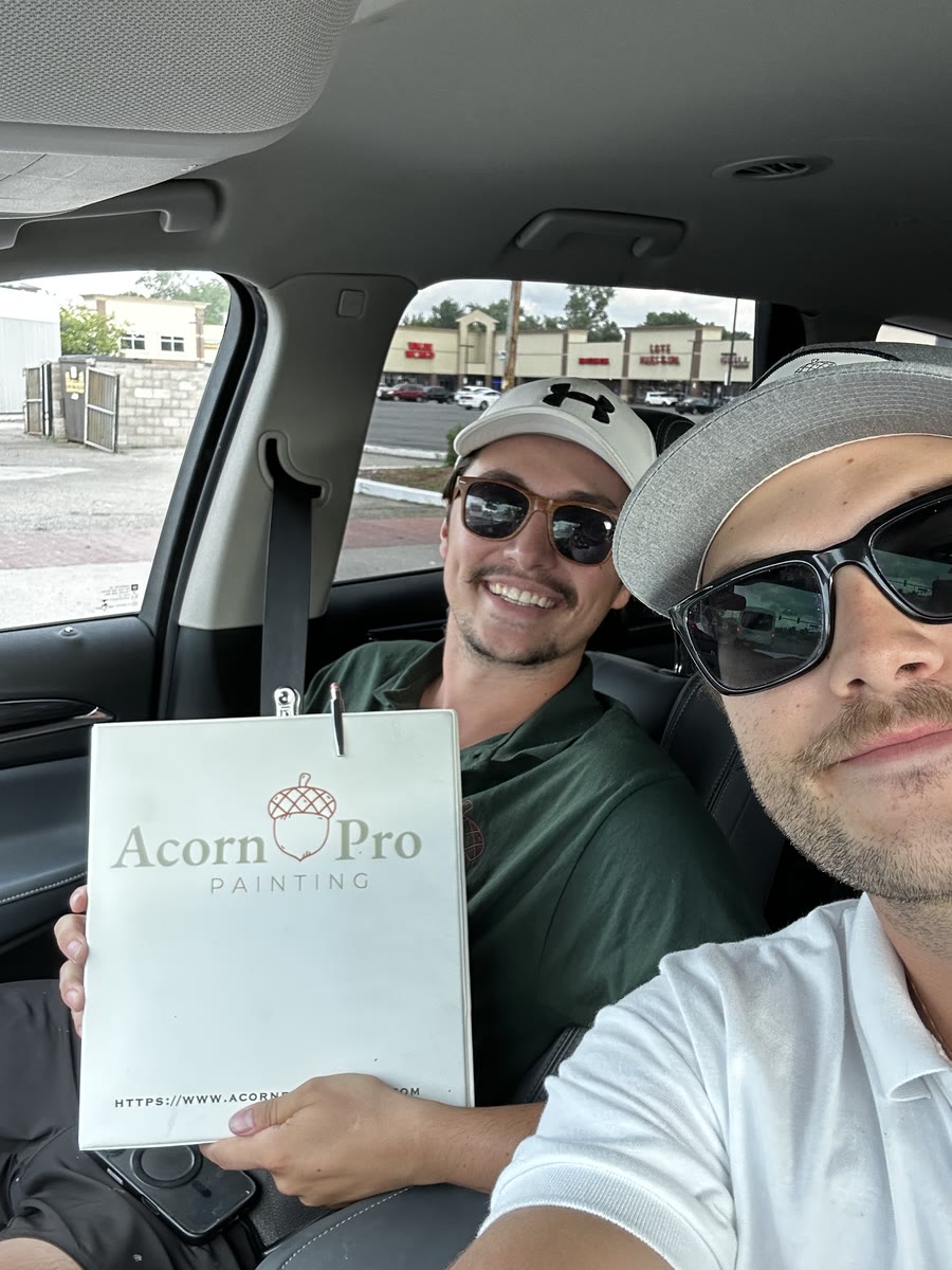 Two Acorn Pro Painting team members heading to a job